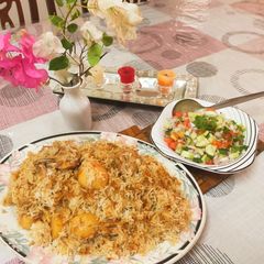 A picture of Chicken and potato pulao / with kachoomar salad.