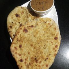 A picture of Heathy Onion stuffed kulcha whole wheat garlic butter.