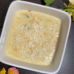 A picture of Creamy coconut, chicken and pea soup.