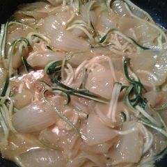 A picture of Buttery curried onions with zucchini "noodles".