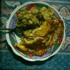 A picture of Mukimo with fried eggs.