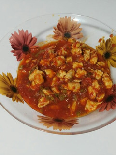 Una foto de Fritá de pollo con pimientos