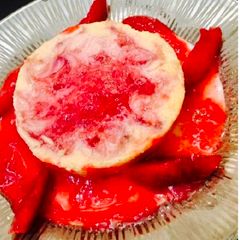 A picture of Baked yogurt with plum sauce.