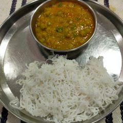 A picture of Idiyappam With Peas vegetable Curry.