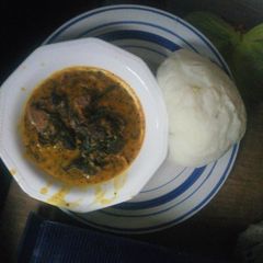 Bitter leaf soup served with poundo yam A picture of Bitter leaf soup served with poundo yam.