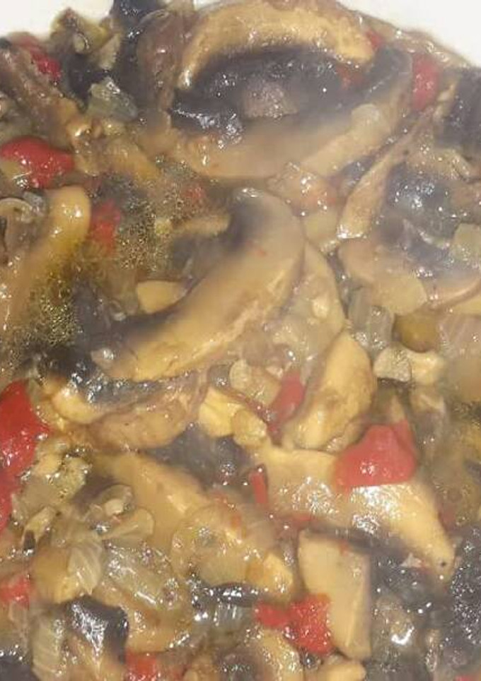 Una foto de Champiñones en salsa