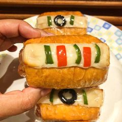 A picture of 3 colour Spring Rolls.