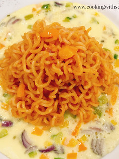 A picture of Kiddies meal... JOLLOF NOODLES and FRIED VEGETABLE OMELETTE.