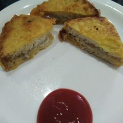 A picture of Schezwan jalapeno cheese bread pakora.