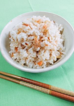A picture of Cooked Rice mixed with Grilled Salmon.