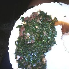 A picture of Ugali served wid kales n beef.