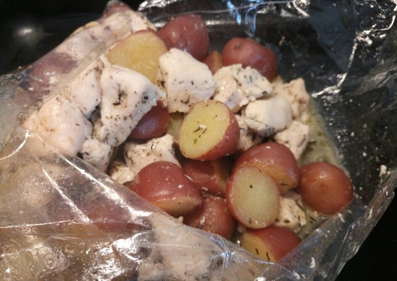 Succulent butter roasted chicken and potatoes in a bag