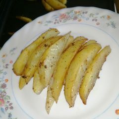 Baked potato wedges A picture of Baked potato wedges.