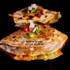 A picture of Aloo Matar Tikki Paneer Schezwan Tortilla Quesadilla.