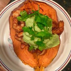 A picture of Spicy Shrimp Sweet Potato Boat and Avocado Crema.