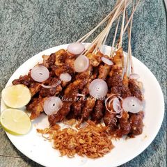 A picture of Indonesian Chicken Satay With Peanut Sauce.