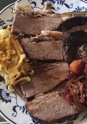 A picture of California Farm Brisket for Passover with Dates, Mushrooms and Potato Kugel.