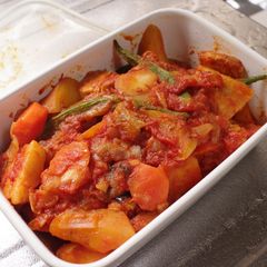 A picture of Braised Pork belly and sweet potato with tomato.