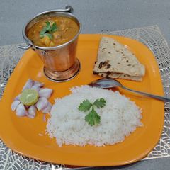 A picture of Mushroom Masala in red gravy.