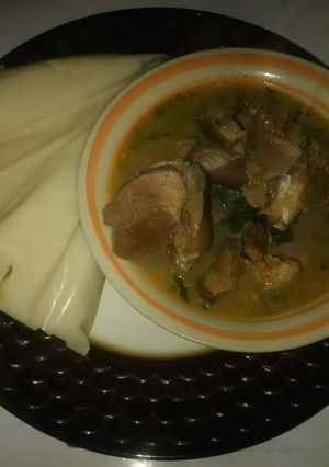A picture of Agidi with goatmeat peppersoup.