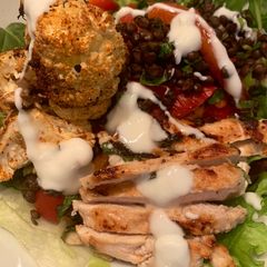 A picture of Harissa spiced cauliflower with lemon and mint chicken and lentils.