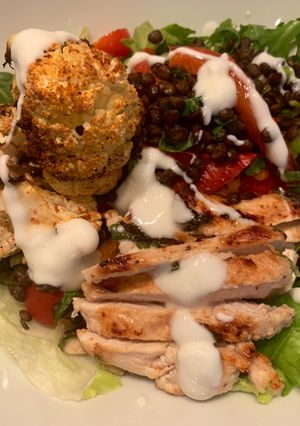 A picture of Harissa spiced cauliflower with lemon and mint chicken and lentils.