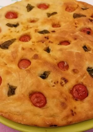A picture of Focaccia with Tomato and Basil.