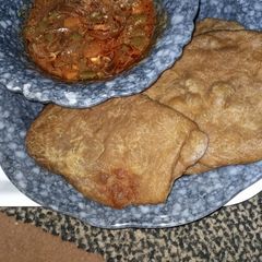 A picture of Pateera with carrots sauce.
