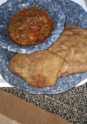 A picture of Pateera with carrots sauce.