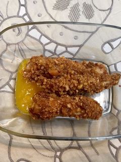 Una foto de Pollo a las tres texturas con coulis de mango