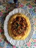Polenta con sugo di carciofi e piselli