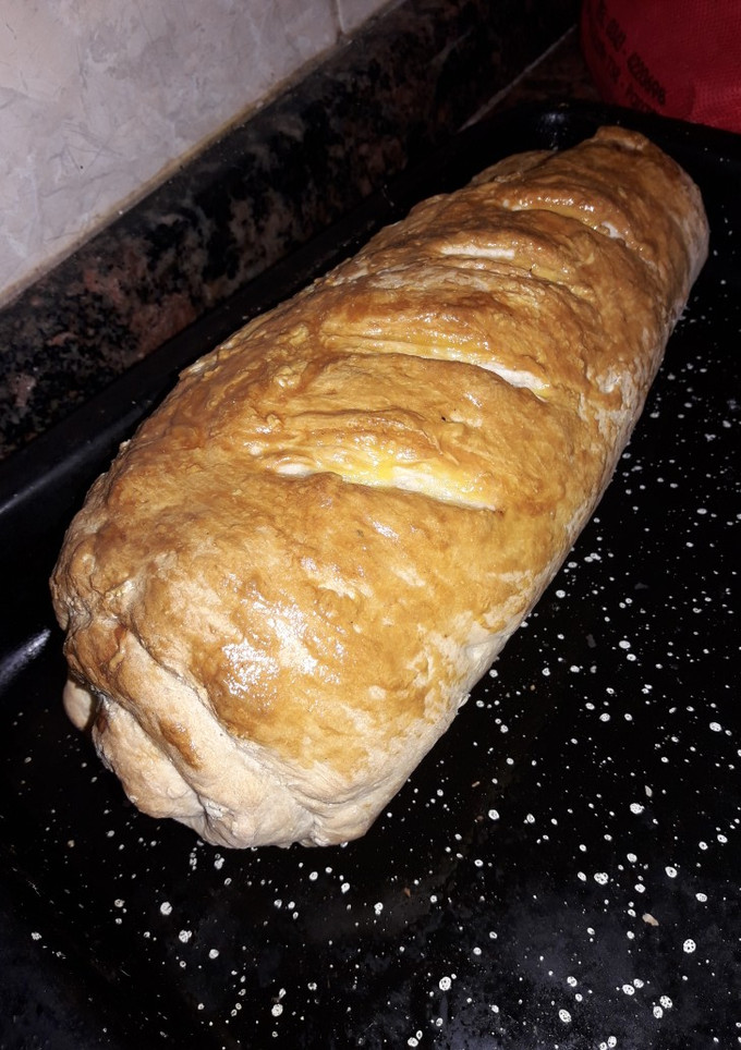 Una foto de Pan casero relleno de milan y queso