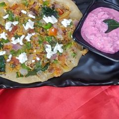 Uttapam with beetroot Dip A picture of Uttapam with beetroot Dip.
