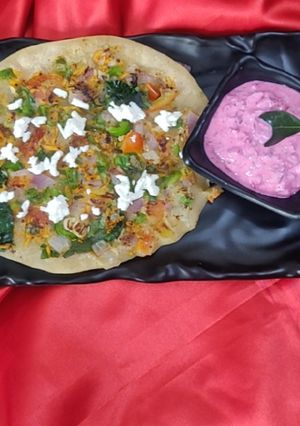 A picture of Uttapam with beetroot Dip.