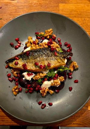 A picture of Pan Fried Mackerel, Beetroot & Goat's Cheese Carpaccio, Candy Walnuts, Orange & Dill Vinaigrette.