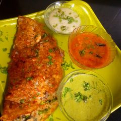 A picture of Moong Onion Rava Dosa.