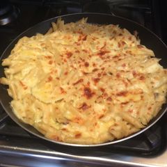 A picture of Layered potato with baby spinach and packet pasta.