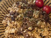 A picture of thin sliced beef with rice