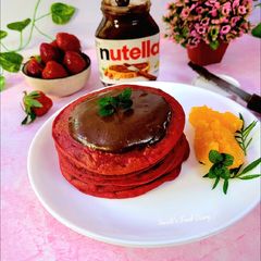 A picture of Red Velvet Pancakes with Nutella.