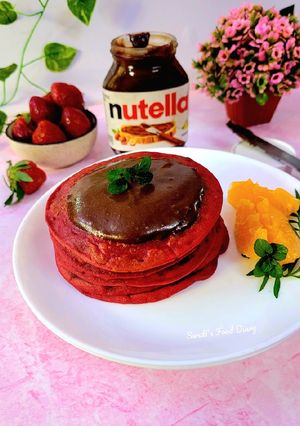 A picture of Red Velvet Pancakes with Nutella.