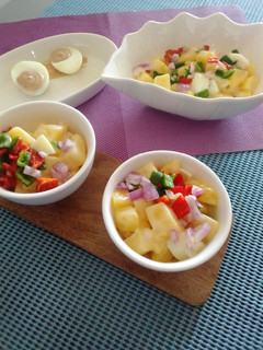A picture of Potato salad wight a side of deviled eggs.