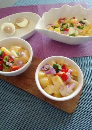 A picture of Potato salad wight a side of deviled eggs.