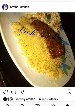 A picture of Steamed cous cous with stew.