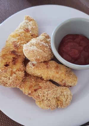 Una foto de Tiras de pollo al horno con parmesano