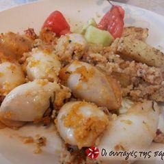 A picture of Calamari stuffed with cracked wheat and vegetables.