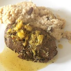 A picture of Duck chest with couscous.