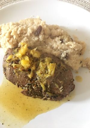 A picture of Duck chest with couscous.