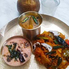 A picture of Vegetables Matta Rice with Thakkali Pachadi and Sambhar.