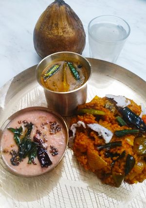 A picture of Vegetables Matta Rice with Thakkali Pachadi and Sambhar.
