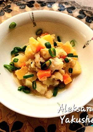 A picture of Seabass with vegetables in the oven.